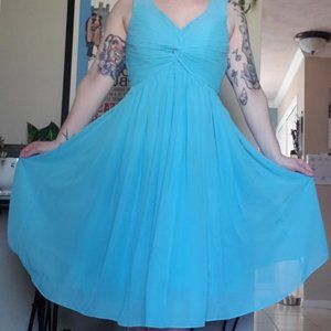 Knee-length blue dress with ruched bodice